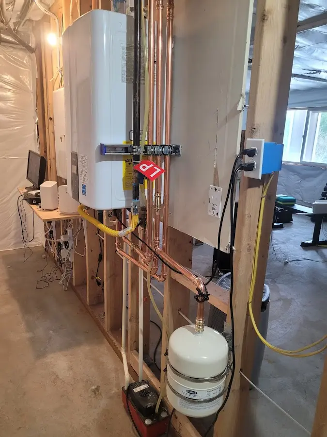 Licensed plumber repairing a kitchen sink in Mount Repose